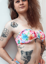 Load image into Gallery viewer, Woman wearing a colorful bikini with tattoos on her arms and legs against a white background
