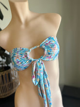 Load image into Gallery viewer, Blue floral bikini top on a mannequin with a neutral background