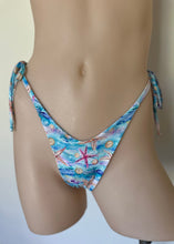 Load image into Gallery viewer, Bikini bottom with starfish and shell pattern on a mannequin against a plain background