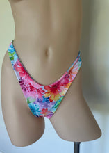 Load image into Gallery viewer, Mannequin wearing a colorful floral bikini bottom against a neutral background