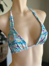 Load image into Gallery viewer, Colorful bikini top on a mannequin with a blurred background