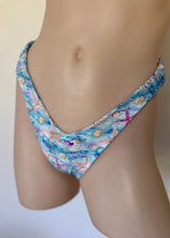 Load image into Gallery viewer, Blue and pink patterned bikini bottom on a neutral background