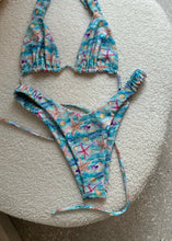 Load image into Gallery viewer, Floral bikini set on a round white surface