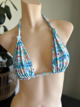 Load image into Gallery viewer, Blue bikini top with beach-themed print on a mannequin against a neutral background