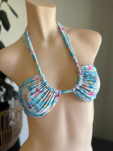 Load image into Gallery viewer, Blue bikini top with floral pattern on a mannequin against a neutral background