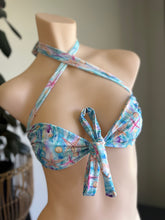 Load image into Gallery viewer, Floral bikini top on a mannequin against a neutral background