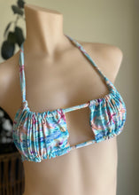 Load image into Gallery viewer, Multicolored bikini top on a mannequin against a neutral background