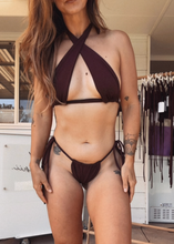 Load image into Gallery viewer, Person wearing a black bikini in a store setting