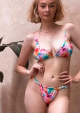 Load image into Gallery viewer, Woman wearing a colorful bikini set against a neutral background