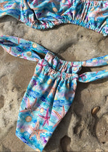 Load image into Gallery viewer, Colorful bikini set with starfish and shell pattern on sand
