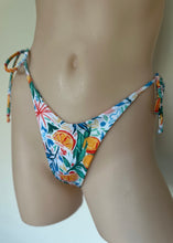 Load image into Gallery viewer, Colorful floral-patterned bikini bottom on a neutral background
