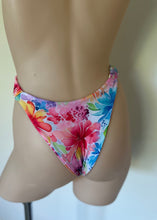 Load image into Gallery viewer, Colorful floral bikini bottom on a mannequin against a neutral background
