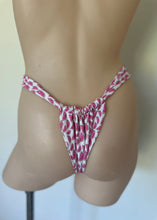 Load image into Gallery viewer, Mannequin wearing a pink and white patterned thong against a plain background
