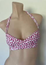 Load image into Gallery viewer, Pink and white patterned bikini top on a mannequin against a plain background
