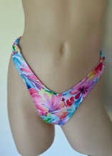 Load image into Gallery viewer, Colorful floral bikini bottom on a plain background

