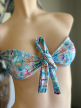 Load image into Gallery viewer, Colorful bikini top with starfish and shell pattern on a mannequin.
