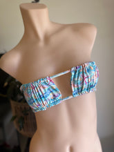 Load image into Gallery viewer, Multicolored bikini top on a mannequin against a neutral background
