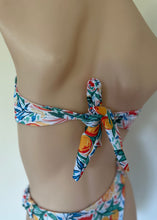 Load image into Gallery viewer, Colorful floral bikini on a mannequin against a neutral background
