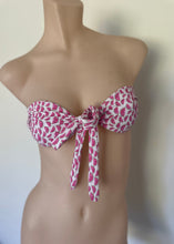 Load image into Gallery viewer, Pink and white patterned bikini top on a mannequin against a neutral background

