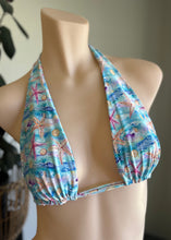 Load image into Gallery viewer, Colorful bikini top with starfish pattern on a mannequin against a neutral background
