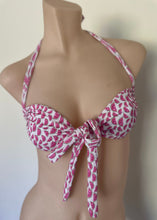 Load image into Gallery viewer, Pink and white patterned bikini top on a mannequin against a plain background
