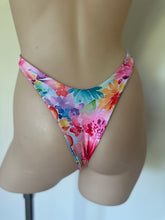 Load image into Gallery viewer, Colorful floral bikini bottom on a mannequin against a neutral background
