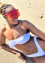 Load image into Gallery viewer, Person wearing a white bikini on a sandy beach
